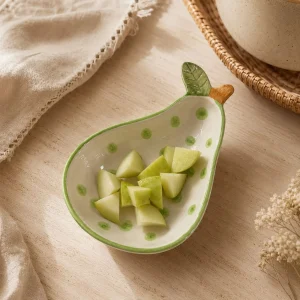 The Plush Republic Handcrafted Green Polka Dot Pear Bowl with Leaf Handle