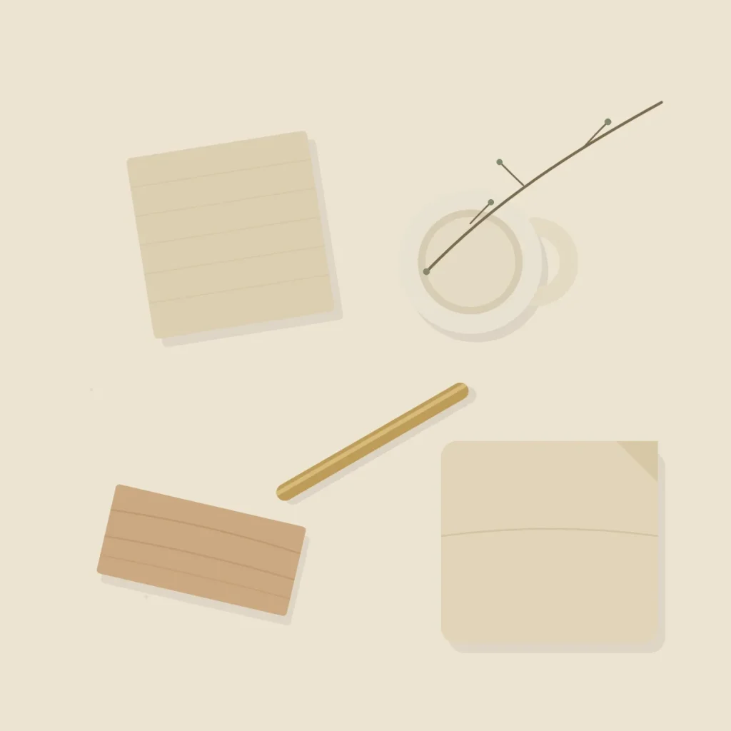 A top-down flat-lay of Japandi materials on a cream stone surface: a square of raw linen, a piece of pale oak, an off-white ceramic mug, a length of brushed brass, a folded oatmeal cushion and a single dried branch.