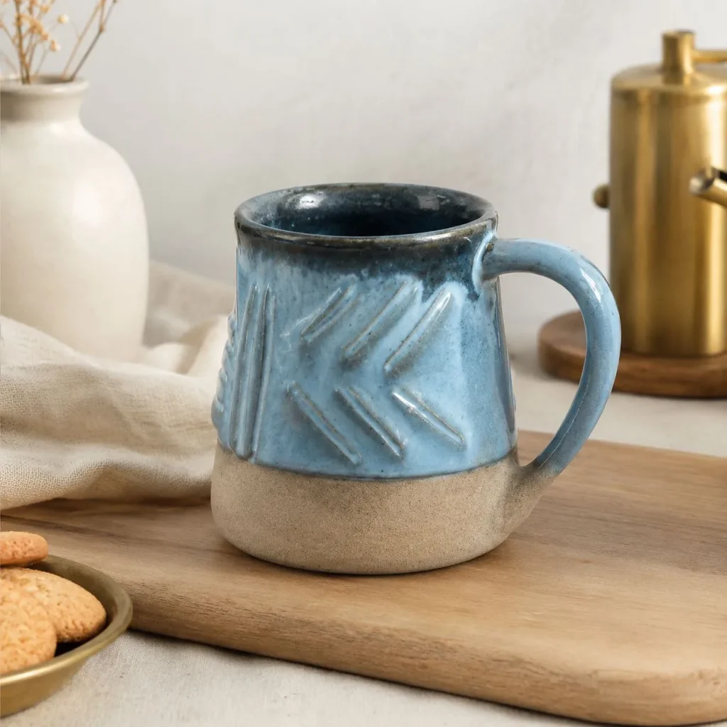 Sky blue brick-textured ceramic mug on a wooden tray